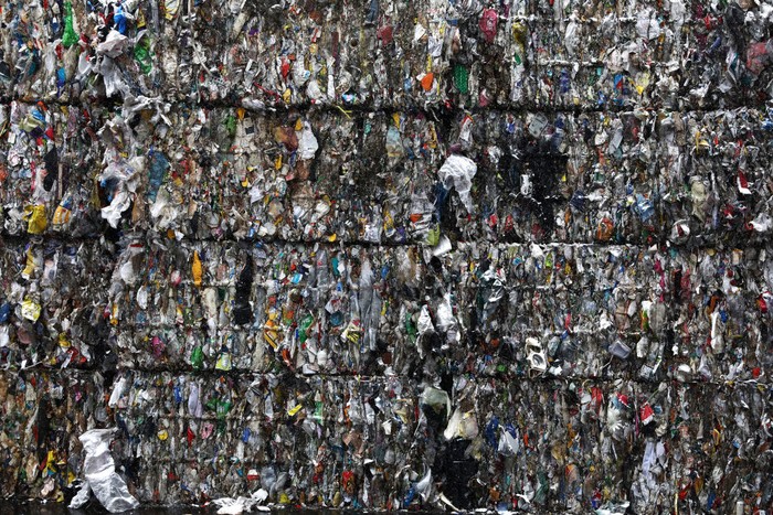 SEOUL, SOUTH KOREA - FEBRUARY 16: Crushed plastic bags and bottles are stacked at a facility that stores recyclable materials following the Lunar New Years holiday on February 16, 2021 in Seoul, South Korea. South Korea was already one of the worlds biggest plastic consuming countries per capita before the pandemic with people on average using 11.5 kilograms of plastic each year. As more people stuck amid coronavirus pandemic at home started relying on online shopping and delivery food, as well as opting for single-use goods, due to worries over infection, plastic waste has been piling up at an alarming rate. (Photo by Chung Sung-Jun/Getty Images)