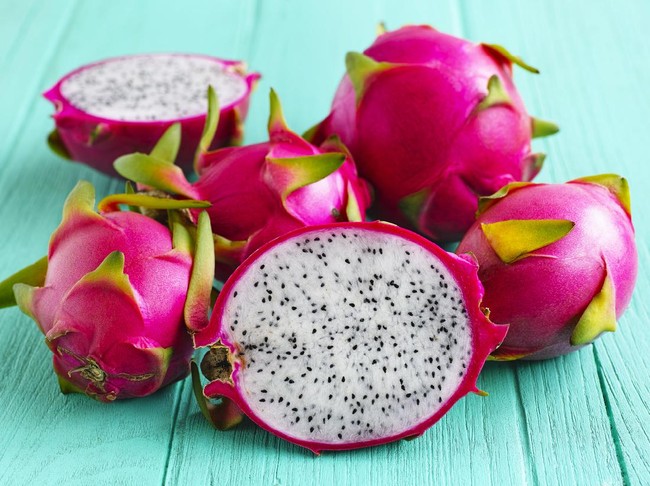 White Dragon Fruit on an old turquoise wooden table.