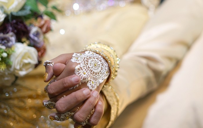 Ilustrasi Pernikahan Aceh Close up Bride and groom hand in hand, Indonesian Wedding Tradition Ceremony