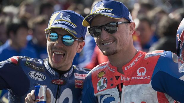 PHILLIP ISLAND, AUSTRALIA - OCTOBER 28:  Maverick Vinales of Spain and  Movistar Yamaha MotoGP  celebrates with Jack Miller of Australia and Alma Pramac Racing (L) under the podium at the end of the MotoGP race during the MotoGP of Australia - Race during the 2018 MotoGP of Australia at Phillip Island Grand Prix Circuit on October 28, 2018 in Phillip Island, Australia.  (Photo by Mirco Lazzari gp/Getty Images)