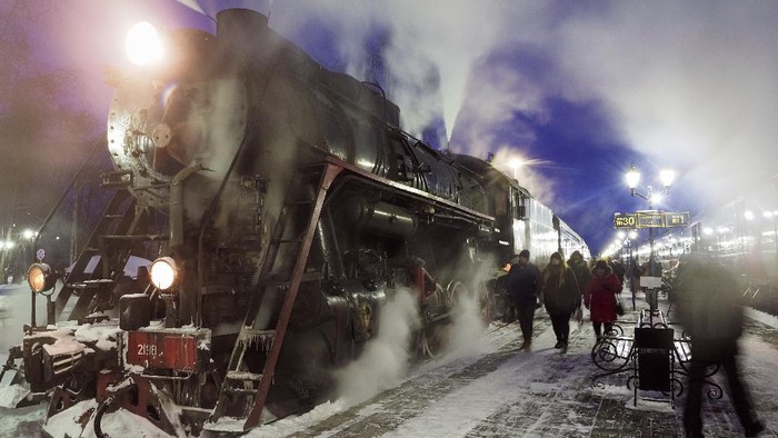 A Soviet era steam locomotive pulls a retro train from the city of Sortavala about 200 km (125 miles) north of St.Petersburg, Russia, Wednesday, Feb. 17, 2021. The steam-powered retro train runs daily in Karelia, a Russian region on the border with Finland, taking tourists to the Ruskeala natural park from the city of Sortavala. (AP Photo/Dmitri Lovetsky)