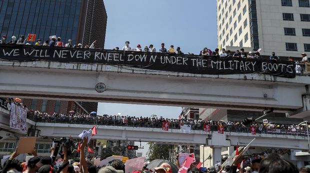 Demonstrators gather in an intersection close to Sule Pagoda to protest against the military coup in Yangon, Myanmar Wednesday, Feb. 17, 2021. The U.N. expert on human rights in Myanmar warned of the prospect for major violence as demonstrators gather again Wednesday to protest the military's seizure of power. (AP Photo)