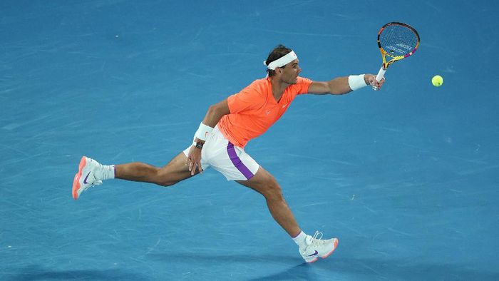 Rafael Nadal MELBOURNE, AUSTRALIA - FEBRUARY 17: Rafael Nadal of Spain plays a forehand during his Men’s Singles Quarterfinals match against Stefanos Tsitsipas of Greece during day 10 of the 2021 Australian Open at Melbourne Park on February 17, 2021 in Melbourne, Australia. (Photo by Matt King/Getty Images)