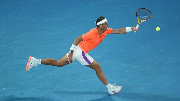 MELBOURNE, AUSTRALIA - FEBRUARY 17:  Rafael Nadal of Spain  plays a forehand during his Men’s Singles Quarterfinals match against Stefanos Tsitsipas of Greece during day 10 of the 2021 Australian Open at Melbourne Park on February 17, 2021 in Melbourne, Australia. (Photo by Matt King/Getty Images)