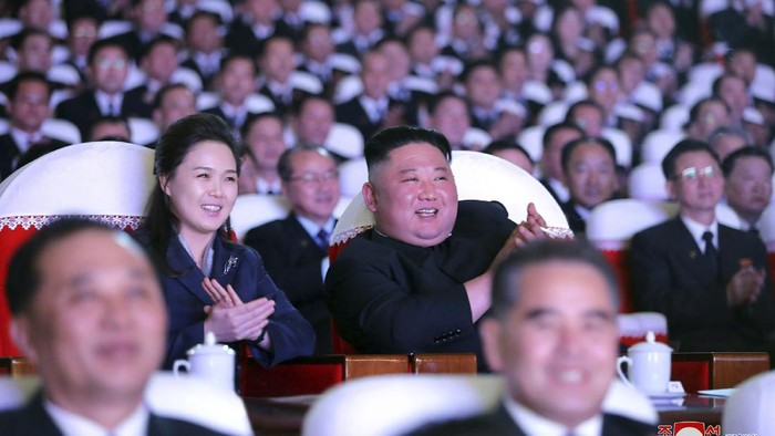 In this photo provided by the North Korean government, North Korean leader Kim Jong Un, center, and his wife Ri Sol Ju watch a performance marking the birth anniversary of former leader Kim Jong Il, in Pyongyang, North Korea, Tuesday, Feb. 16, 2021. Ri has reappeared in North Korea's state media for the first time in just over year. Independent journalists were not given access to cover the event depicted in this image distributed by the North Korean government. The content of this image is as provided and cannot be independently verified. Korean language watermark on image as provided by source reads: 
