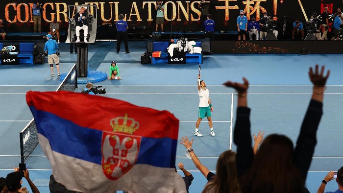 MELBOURNE, AUSTRALIA - FEBRUARY 18:  Novak Djokovic of Serbia waves to the crowd following victory in his Men’s Singles Semifinals match against Aslan Karatsev of Russia during day 11 of the 2021 Australian Open at Melbourne Park on February 18, 2021 in Melbourne, Australia. (Photo by Cameron Spencer/Getty Images)