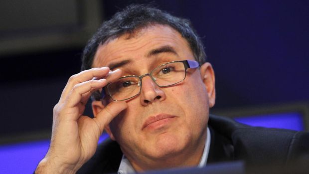 Professor of Economics, Leonard N. Stern School, NYU, USA, Nouriel Roubini adjusts his glasses during a session at the World Economic Forum in Davos, Switzerland on Wednesday, Jan. 26, 2011. Buoyed by a burst of optimism about the global economy and mindful of the 