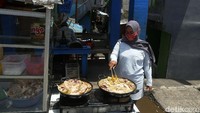 Aktivitas warga Kampung Pulo terlihat normal dan bebas banjir.