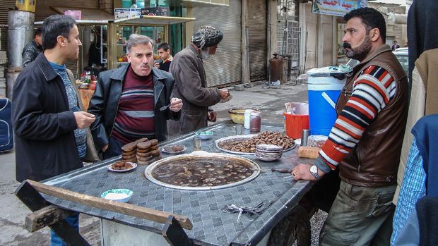 Mobile food Cart selling local food to people passing by in  Bazaar of Erbil, in Northern iraq