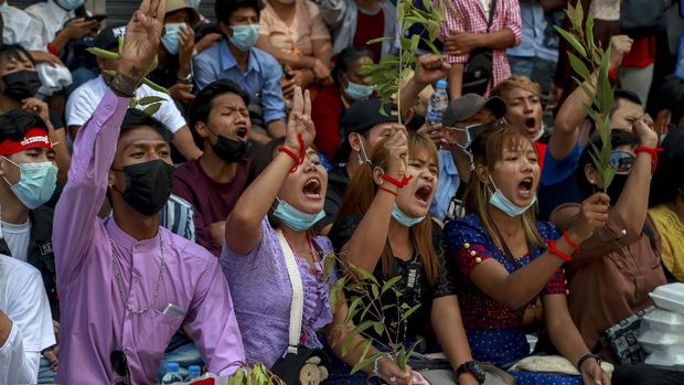 Hundreds of anti-coup protesters march in Yangon, Myanmar, Thursday, Feb. 25, 2021. Social media giant Facebook announced Thursday it was banning all accounts linked to Myanmar's military as well as ads from military-controlled companies in the wake of the army's seizure of power on Feb. 1. (AP Photo)