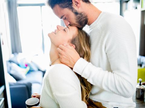 Romantic couple at home share tenderness