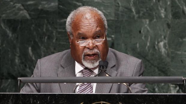 FILE - In this Sept. 27, 2010, file photo, Michael Somare, Prime then Minister of Papua New Guinea addresses the 65th session of the United Nations General Assembly at U.N. headquarters.  Somare, a pivotal figure in Papua New Guinea’s independence and the South Pacific island nation's first prime minister, has died. He was 84. He died Friday, Feb. 26, 2021, after being diagnosed with a late-stage pancreatic cancer and admitted to a hospital on Feb. 19, his daughter Betha Somare said. (AP Photo/Seth Wenig, File)