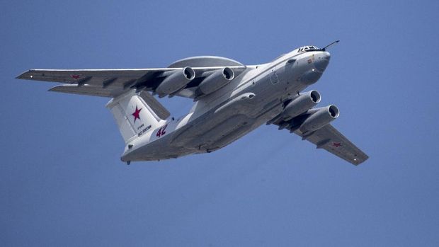 FILE - In this file photo taken on Tuesday, May 7, 2019, A Russian Beriev A-50 airborne early warning and control training aircraft flies over Red Square during a rehearsal for the Victory Day military parade in Moscow, Russia.  South Korean air force jets fired 360 rounds of warning shots after a Russian military plane briefly violated South Korea's airspace twice on Tuesday, Seoul officials said, in the first such incident between the two countries. (AP Photo/Alexander Zemlianichenko, Pool, File)