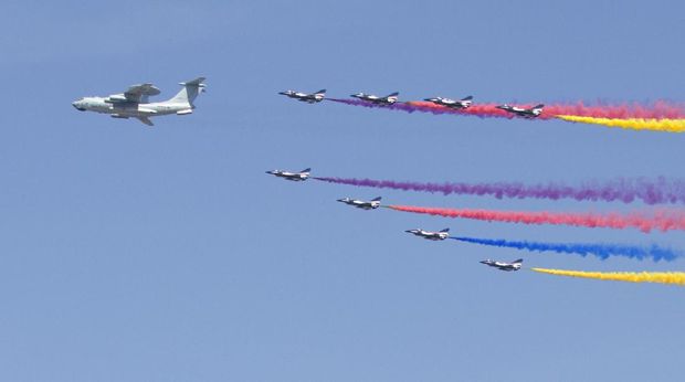 A KJ-2000 airborne early warning and control system plane leads J-10 fighter jets as they fly in formation during a parade commemorating the 70th anniversary of Japan's surrender during World War II in Beijing, Thursday, Sept. 3, 2015. The spectacle involved more than 12,000 troops, 500 pieces of military hardware and 200 aircraft of various types, representing what military officials say is the Chinese military's most cutting-edge technology. (AP Photo/Mark Schiefelbein)