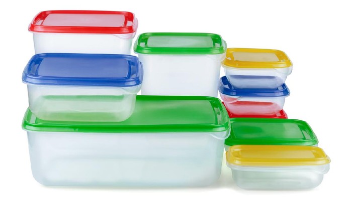 Stack of food plastic containers isolated on white