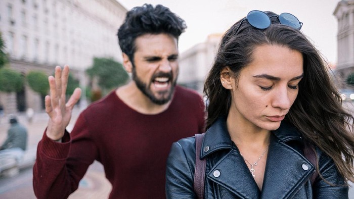 Bearded man shouting at his girlfriend