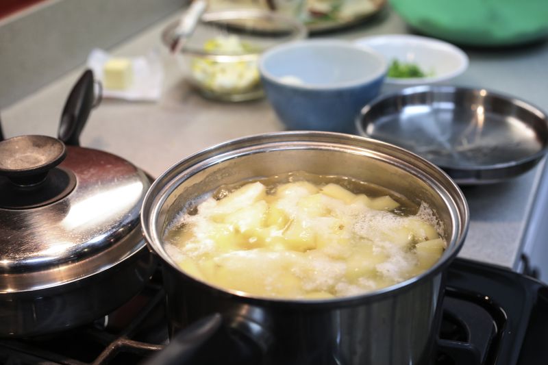 Preparations for making dinner.  Boiling potatoes for mashed potatoes for dinner.