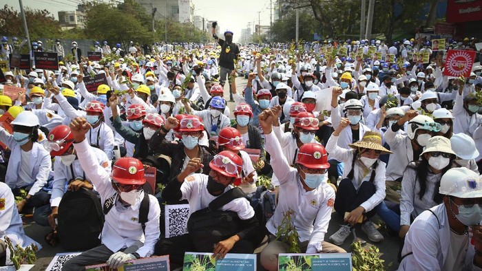 A wounded protester is carried during a protest against the military coup in Mandalay, Myanmar, Sunday, Feb. 28, 2021. Security forces in Myanmar used lethal force as they intensified their efforts to break up protests a month after the military staged a coup. At least four people were reportedly killed on Sunday. (AP Photo)