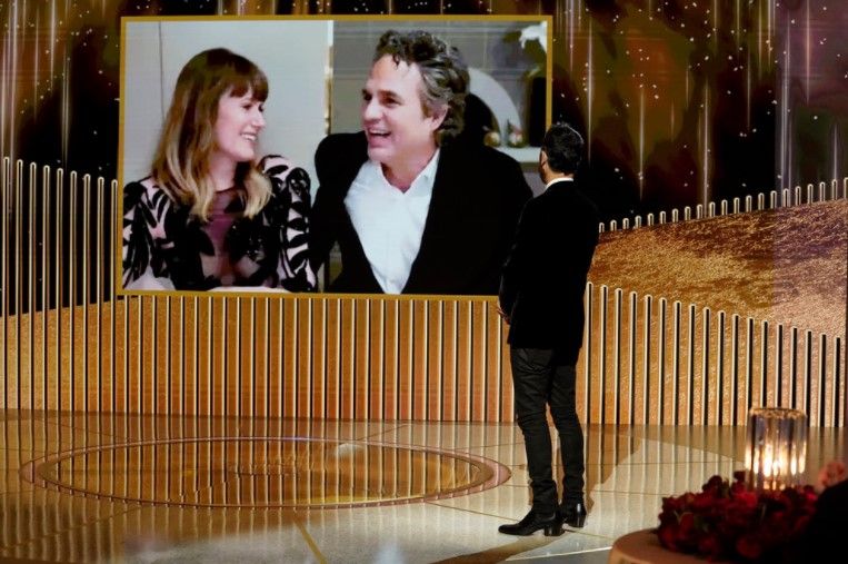 78th ANNUAL GOLDEN GLOBE AWARDS -- Pictured: (l-r) Sunrise Coigney with Mark Ruffalo accepting the Best Actor - Television Motion Picture award for 'I Know This Much Is True' via video; Justin Theroux onstage at the 78th Annual Golden Globe Awards held at the Rainbow Room on February 28, 2021 -- (Photo by: Peter Kramer/NBC)