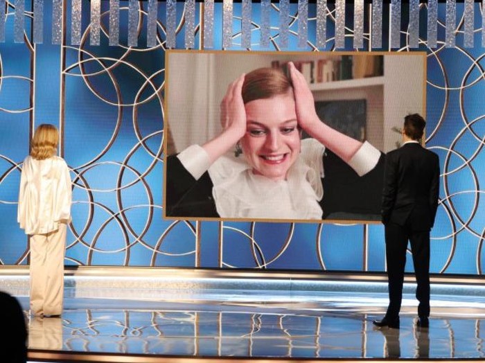78th ANNUAL GOLDEN GLOBE AWARDS -- Pictured: (l-r) Emma Corrin (c) accepts the Best Television Actress – Drama Series award for ‘The Crown’ via video from Kyra Sedgwick (l) and Kevin Bacon at the 78th Annual Golden Globe Awards held at the Beverly Hilton Hotel on February 28, 2021. -- (Photo by: Christopher Polk/NBC)