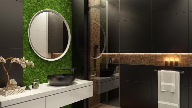 Luxurious bathroom with natural stone tiles and elegant round mirror.Candle lens flare effect. Green moss wall.