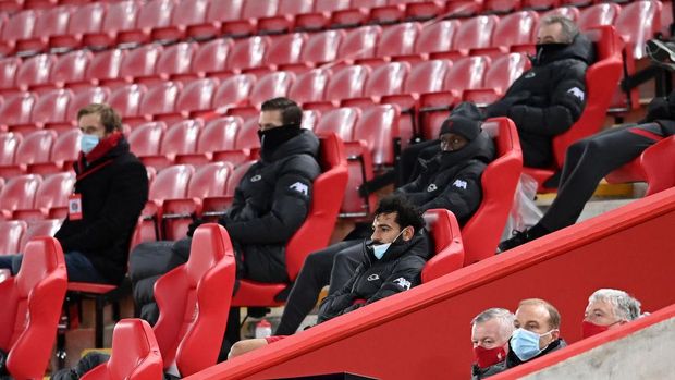 Mohamed Salah LIVERPOOL, ENGLAND - MARCH 04: Mohamed Salah of Liverpool looks on from the bench after being substituted off during the Premier League match between Liverpool and Chelsea at Anfield on March 04, 2021 in Liverpool, England. Sporting stadiums around the UK remain under strict restrictions due to the Coronavirus Pandemic as Government social distancing laws prohibit fans inside venues resulting in games being played behind closed doors. (Photo by Laurence Griffiths/Getty Images)