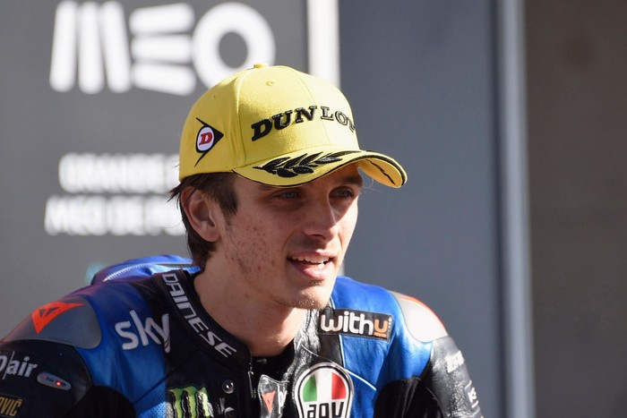 PORTIMAO, PORTUGAL - NOVEMBER 22:  Luca Marini of Italy and Sky Racing Team VR46 speaks with journalist ald celebrates the second place under the podium during the Moto2 race during the MotoGP of Portugal at Algarve Motor Park on November 22, 2020 in Portimao, Portugal. (Photo by Mirco Lazzari gp/Getty Images)