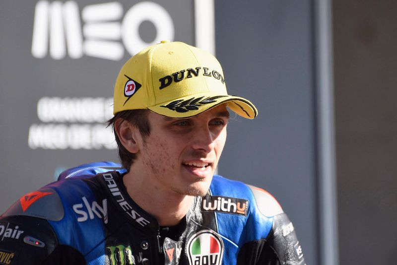 PORTIMAO, PORTUGAL - NOVEMBER 22:  Luca Marini of Italy and Sky Racing Team VR46 speaks with journalist ald celebrates the second place under the podium during the Moto2 race during the MotoGP of Portugal at Algarve Motor Park on November 22, 2020 in Portimao, Portugal. (Photo by Mirco Lazzari gp/Getty Images)