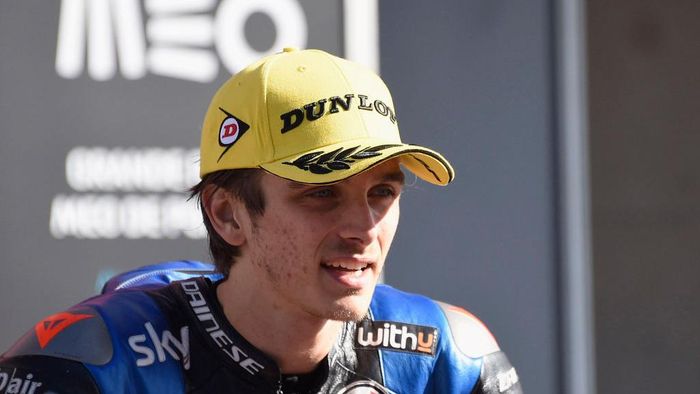 Luca Marini PORTIMAO, PORTUGAL - NOVEMBER 22: Luca Marini of Italy and Sky Racing Team VR46 speaks with journalist ald celebrates the second place under the podium during the Moto2 race during the MotoGP of Portugal at Algarve Motor Park on November 22, 2020 in Portimao, Portugal. (Photo by Mirco Lazzari gp/Getty Images)