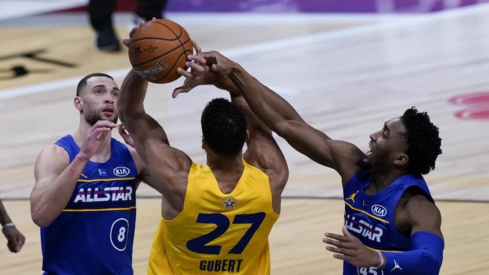 Utah Jazz guard Donovan Mitchell blocks a shot by Utah Jazz center Rudy Gobert during the second half of basketballs NBA All-Star Game in Atlanta, Sunday, March 7, 2021. (AP Photo/Brynn Anderson)
