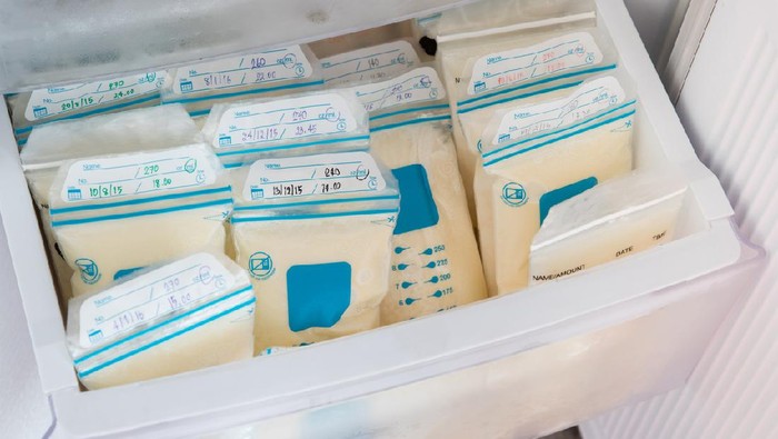 breast milk in plastic bags on refrigerator shelf, frozen mother milk  for infant, breastfeeding