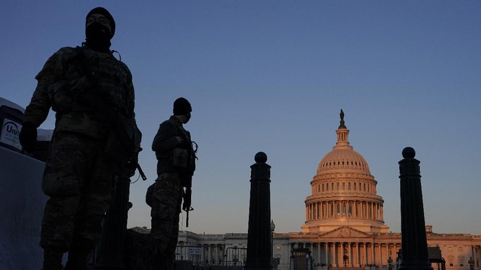 National Guard stand their posts around the Capitol at sunrise in Washington, Monday, March 8, 2021. (AP Photo/Carolyn Kaster)
