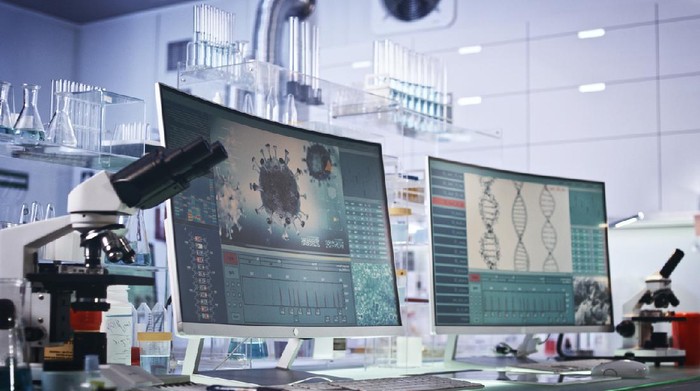 1251892821 Modern laboratory interior. Coronavirus research. Word Covid-19 on the screen