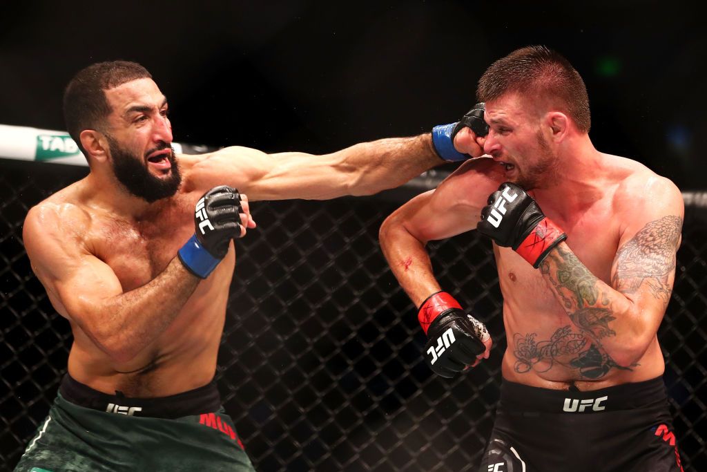SYDNEY, AUSTRALIA - NOVEMBER 19:  Belal Muhammad (L) of the USA kicks Tim Means of the USA in their welterweight bout during the UFC Fight Night at Qudos Bank Arena on November 19, 2017 in Sydney, Australia.  (Photo by Mark Kolbe/Getty Images)