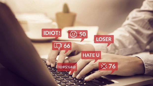 cyber bullying concept. people using notebook computer laptop for social media interactions with notification icons of hate speech and mean comment in social network
