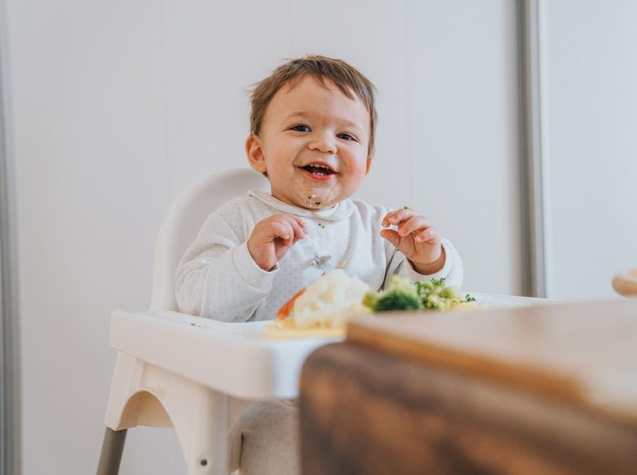 Baby eating vegetables