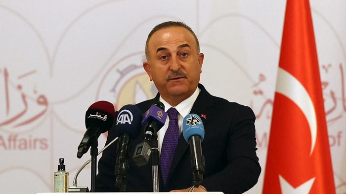 Turkish Foreign Minister Mevlut Cavusoglu attends a joint press conference following a tripartite meeting with his Russian and Qatari counterparts, on March 11, 2021 in Doha. (Photo by KARIM JAAFAR / AFP)