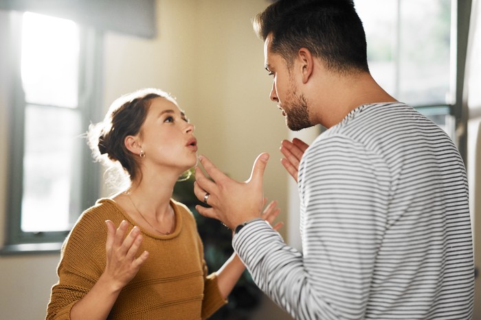 1162106983 Cropped shot of a young couple having an argument at home