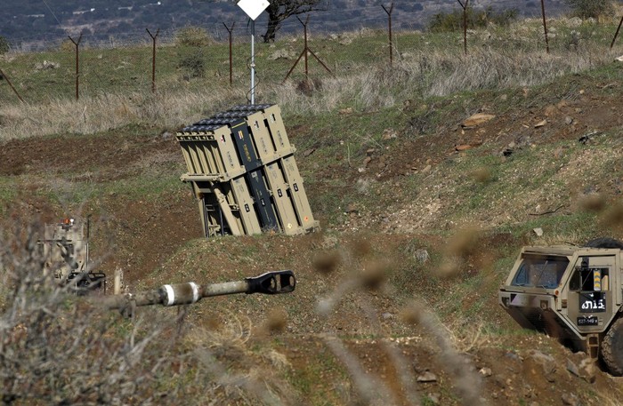 A battery of Israels Iron Dome, designed to intercept and destroy incoming short-range rockets and artillery shells, is pictured in the Israeli-annexed Golan Heights near the border with Syria, on November 18, 2020. - Israeli warplanes struck Syria Wednesday, hitting Iranian targets and killing 10 Syrian and foreign fighters in what the Israeli army called a retaliatory attack after explosive devices were found near one of its bases on the occupied Golan Heights. (Photo by JALAA MAREY / AFP)