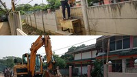 Dulu, penghuni rumah harus memanjat untuk keluar-masuk rumah. Kini tak ada lagi tembok beton yang menutupi rumah itu. (Grandyos Zafna/detikcom)