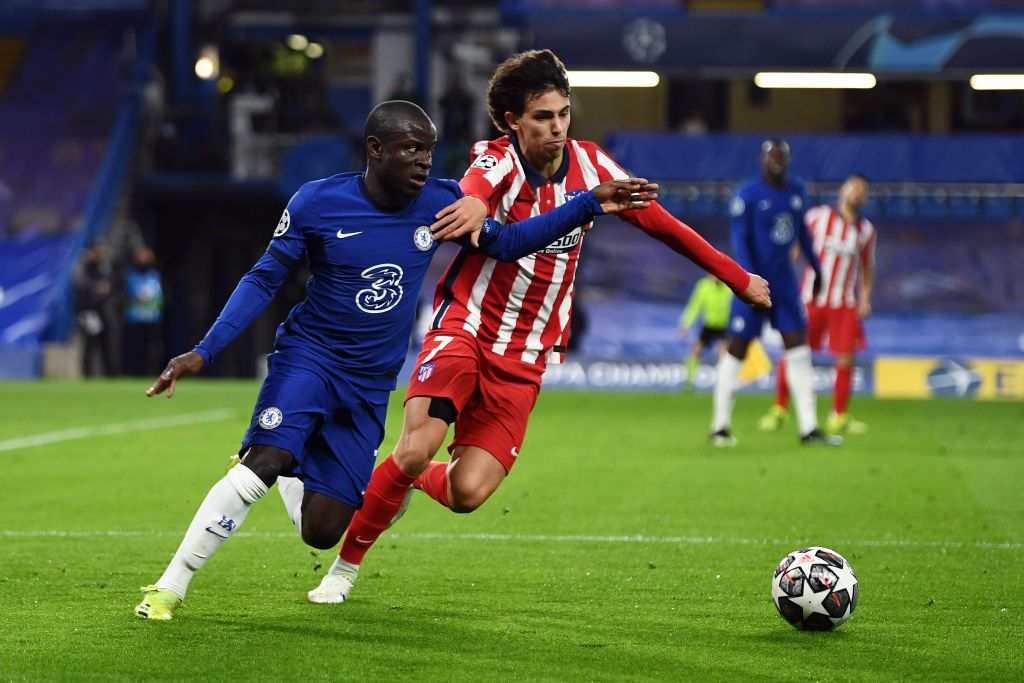 LONDON, ENGLAND - MARCH 17: Ngolo Kante of Chelsea  runs with the ball  during the UEFA Champions League Round of 16 match between Chelsea FC and Atletico Madrid at Stamford Bridge on March 17, 2021 in London, England. Sporting stadiums around the UK remain under strict restrictions due to the Coronavirus Pandemic as Government social distancing laws prohibit fans inside venues resulting in games being played behind closed doors. (Photo by Mike Hewitt/Getty Images)