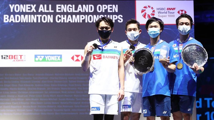 BIRMINGHAM, ENGLAND - MARCH 21: Yuta Watanabe and Hiroyuki Endo pose with the trophy after their victory in the Mens Double final with Takeshi Kamura and Keigo Sonoda of Japan during day five of YONEX All England Open Badminton Championships at Utilita Arena Birmingham on March 21, 2021 in Birmingham, England. (Photo by Naomi Baker/Getty Images)