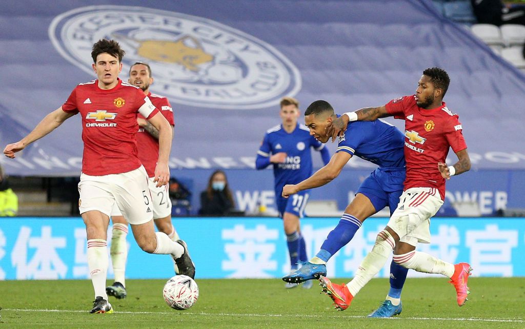LEICESTER, ENGLAND - MARCH 21: Youri Tielemans of Leicester City scores their side's second goal whilst under pressure from Fred of Manchester United during the Emirates FA Cup Quarter Final  match between Leicester City and Manchester United at The King Power Stadium on March 21, 2021 in Leicester, England. Sporting stadiums around the UK remain under strict restrictions due to the Coronavirus Pandemic as Government social distancing laws prohibit fans inside venues resulting in games being played behind closed doors.  (Photo by Alex Pantling/Getty Images)