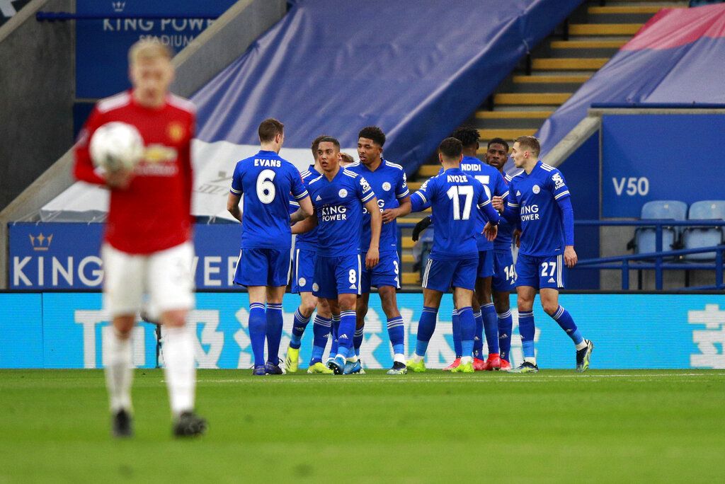 Leicester's Kelechi Iheanacho celebrates with teammates after scoring his side's opening goal during the English FA Cup quarter final soccer match between Leicester City and Manchester United at the King Power Stadium in Leicester, England, Sunday, March 21, 2021. (AP Photo/Ian Walton, Pool)