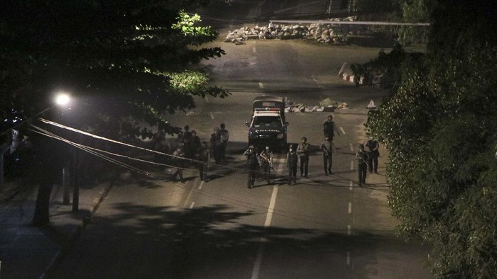 Armed police patrol a street in downtown Yangon, Myanmar, Sunday, March 21, 2021. Protests against the coup continued in cities and town across the country, including in Mandalay and Yangon. (AP Photo)
