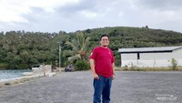 Photo berlatar Bukit Harapan