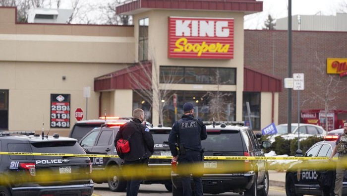 Police stand outside a King Soopers grocery store where a shooting took place, Monday, March 22, 2021, in Boulder, Colo. (AP Photo/David Zalubowski)