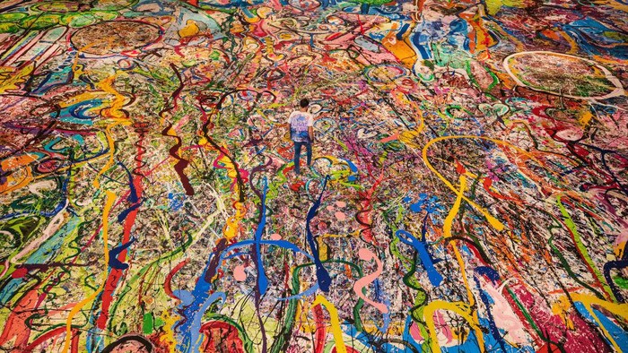 DUBAI, UNITED ARAB EMIRATES - SEPTEMBER 09: Artist Sacha Jafri works on his canvas Humanity Inspired on September 09, 2020 in Dubai, United Arab Emirates. Sacha Jafri is embarking on a global initiative to create the world’s largest painting on canvas. Jafri has been in lockdown at Atlantis, The Palm since March 2020, creating his record-breaking Painting entitled ‘The Journey of Humanity’. (Photo by Francois Nel/Getty Images)