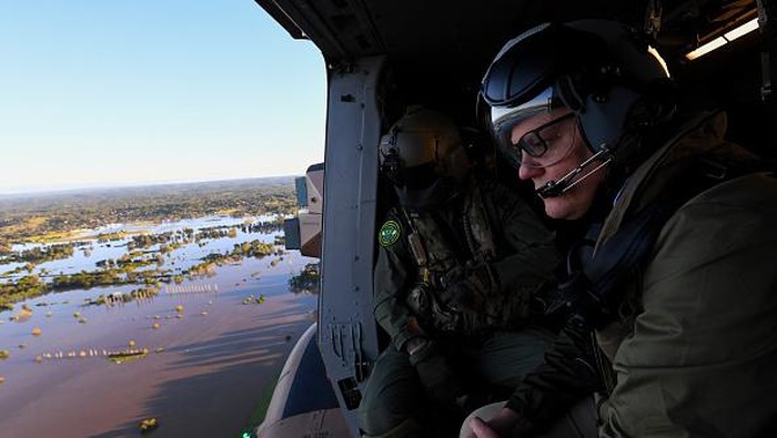 SYDNEY, AUSTRALIA - MARCH 24:  Australian Prime Minister Scott Morrison inspects damage created by floodwaters from a helicopter during a visit to flood affected areas on March 24, 2021 in Sydney, Australia. Recovery and flood clean up begins for parts of Western Sydney following days of continuous rain leading to dozens of communities declared disaster zones. (Photo by Lukas Coch - Pool/Getty Images)