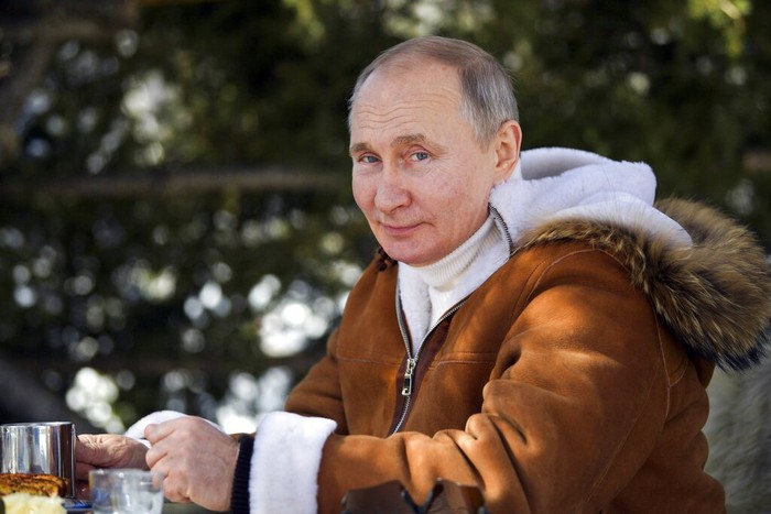 In this photo made available on Sunday, March 21, 2021, Russian President Vladimir Putin poses for a photo in a taiga forest in Russias Siberian region. Putin and Russia Defense Minister Sergei Shoigu are spending the weekend in Siberia said Kremlin spokesman Dmitry Peskov. (Alexei Druzhinin, Sputnik, Kremlin Pool Photo via AP)